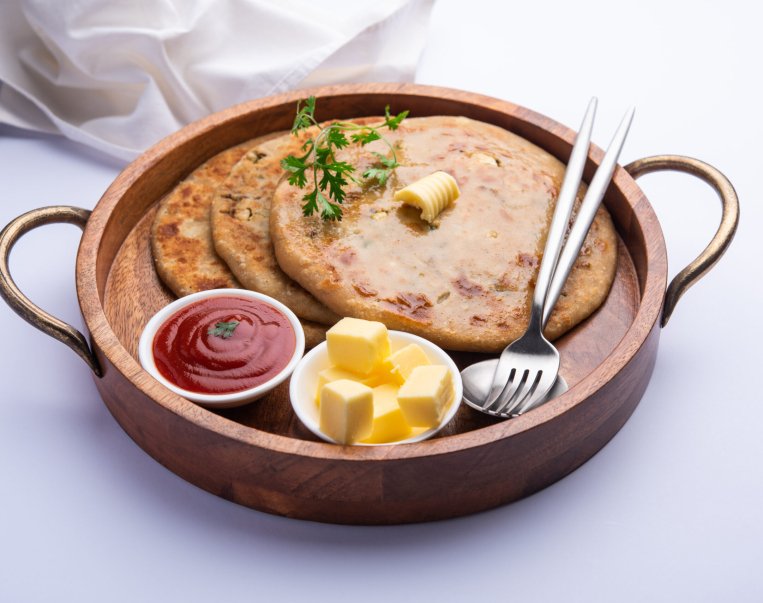 Aloo paratha or gobi paratha also known as Potato or Cauliflower stuffed flatbread dish originating from the Indian subcontinent